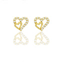 Orecchini Oro Giallo Oro 18 carati Contorno doppio cuore pavè Zirconi Bianchi lunghezza cm.0,80 larghezza cm.0,70